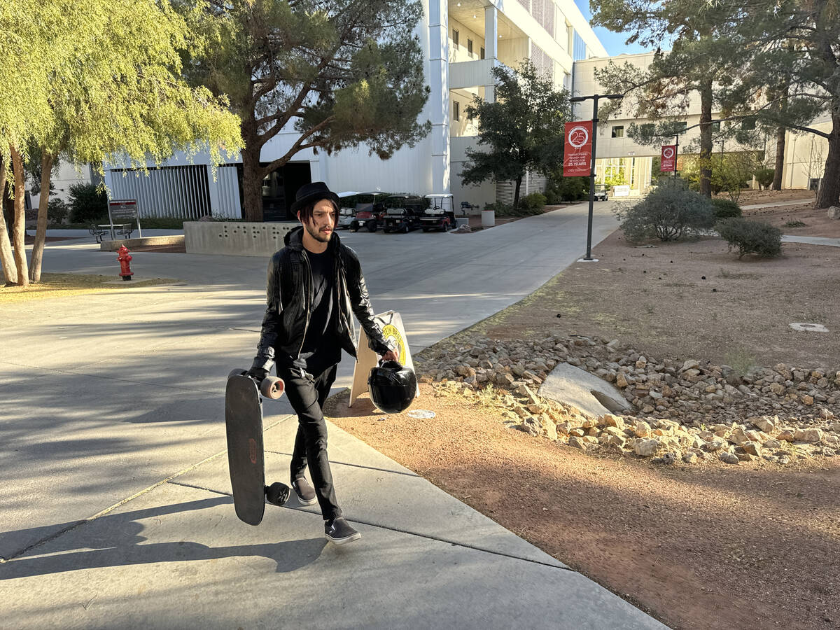 Staff member Gregory Galindo retrieves personal items left behind by friends on the UNLV campus ...