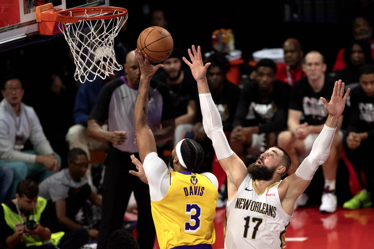 Los Angeles Lakers forward Anthony Davis (3) shoots against New Orleans Pelicans center Jonas V ...