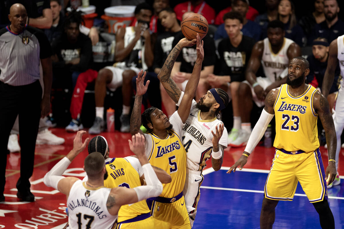 New Orleans Pelicans forward Brandon Ingram (14) shoots against Los Angeles Lakers forward Cam ...