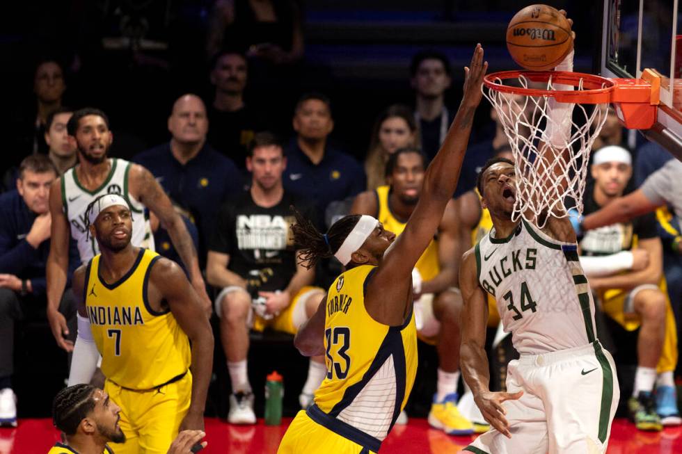 Milwaukee Bucks forward Giannis Antetokounmpo (34) shoots against Indiana Pacers center Myles T ...