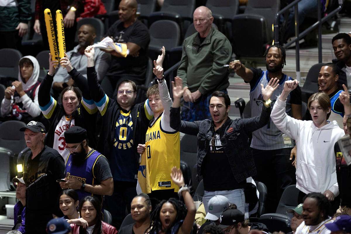 Fans cheer for their teams during the second half of an NBA In-Season Tournament semifinal game ...