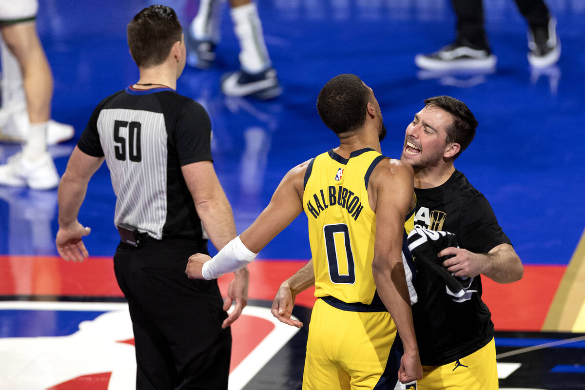Indiana Pacers guard Tyrese Haliburton celebrates with a teammate during the second half of an ...