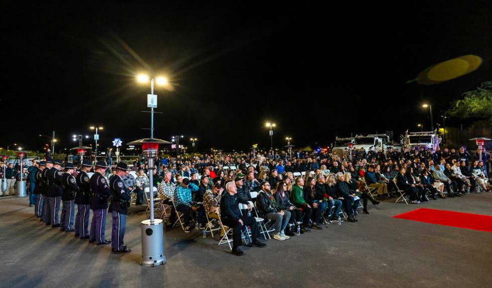 Family members and others gather during a candlelight vigil for Nevada Highway Patrol troopers ...