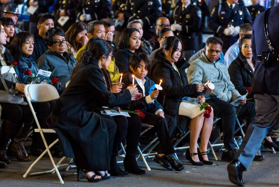 Family and supporters light candles during a candlelight vigil for Nevada Highway Patrol troope ...