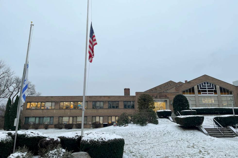 A menorah stands outside the entrance to Temple Israel, Thursday, Dec. 7, 2023, in Albany, N.Y. ...