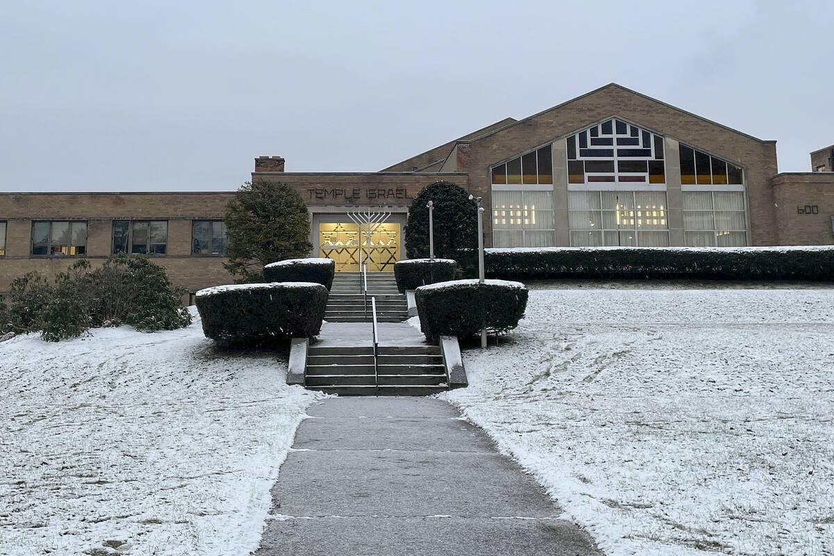 A menorah stands outside the entrance to Temple Israel, Thursday, Dec. 7, 2023, in Albany, N.Y. ...