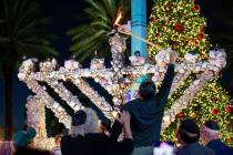 The community gathered to light artist Roger Abramson's unique seashell covered menorah in 2021 ...