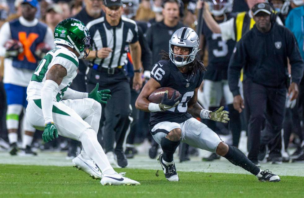 Raiders wide receiver Jakobi Meyers (16) looks to make a move past New York Jets cornerback Mic ...