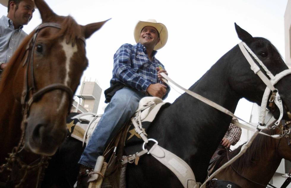 Calf Roper Cody Ohl of Stephenville, Texas waits on a horse before the start of the PRCA Pro Ro ...