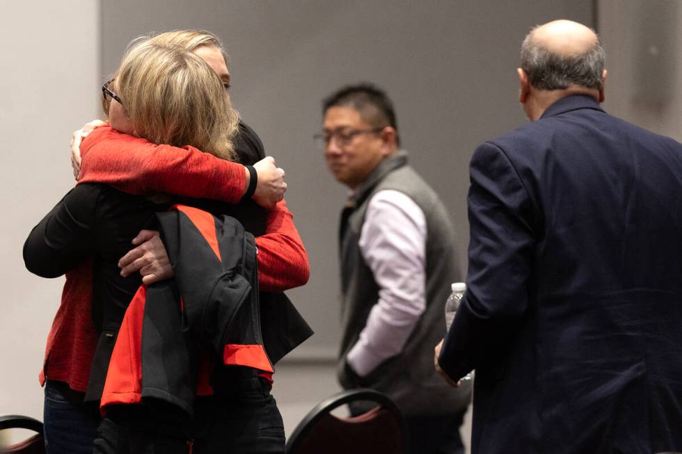 UNLV staff embraces after a news conference held in response to a Wednesday shooting at the uni ...