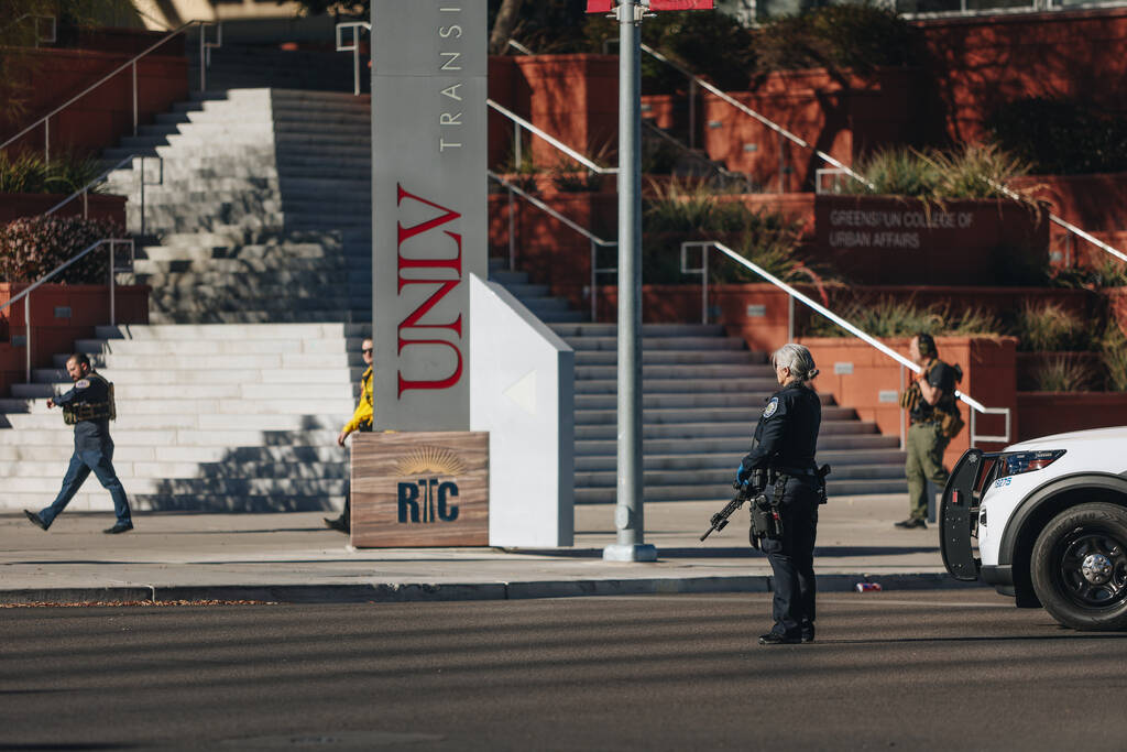 Police are seen at the scene of a shooting on the UNLV campus on Wednesday, Dec. 6, 2023, in La ...