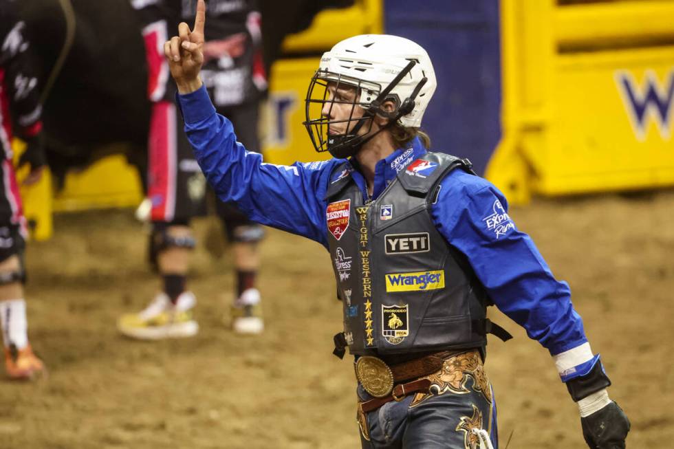 Stetson Wright, of Milford, Utah, celebrates after riding Relentless while competing in bull ri ...