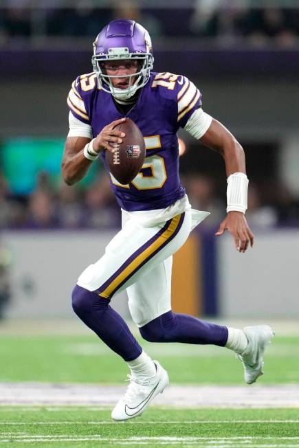 Minnesota Vikings quarterback Joshua Dobbs (15) runs with the football during the first half of ...