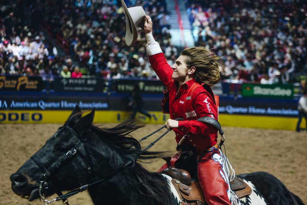 Rocker Steiner does a celebratory lap after winning the first go-round of bareback riding with ...