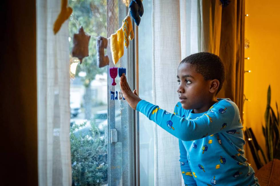 Six-year-old Jack Kulbersh prepares for Hanukkah at home in Studio City, California. (Jason Arm ...