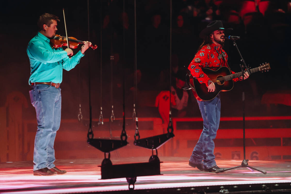 Country singer Ian Munsick performs his song “Long Live Cowgirls” during NFR at t ...