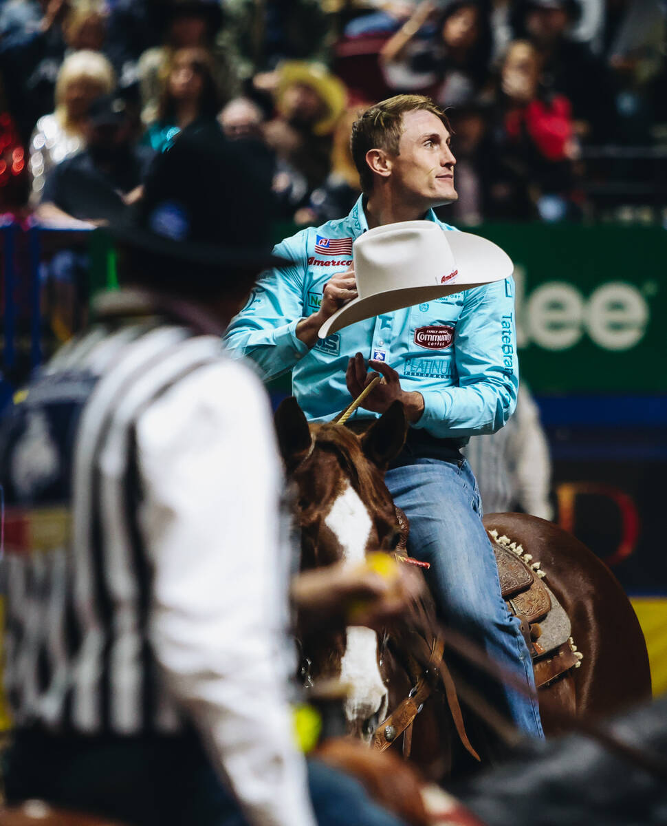 Tuf Cooper gestures towards the crowd during the tie down roping event at the National Finals R ...