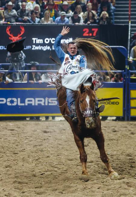Tim O’Connell gets bucked during bareback riding on day three of the National Finals Rod ...