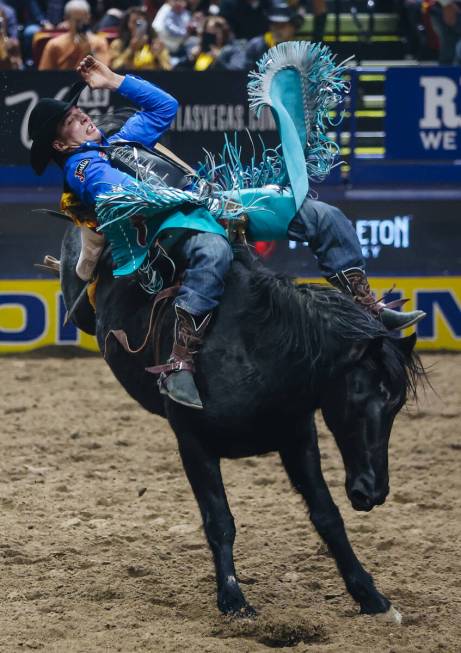 Jess Pope stays on the horse during day three of the National Finals Rodeo at the Thomas & ...