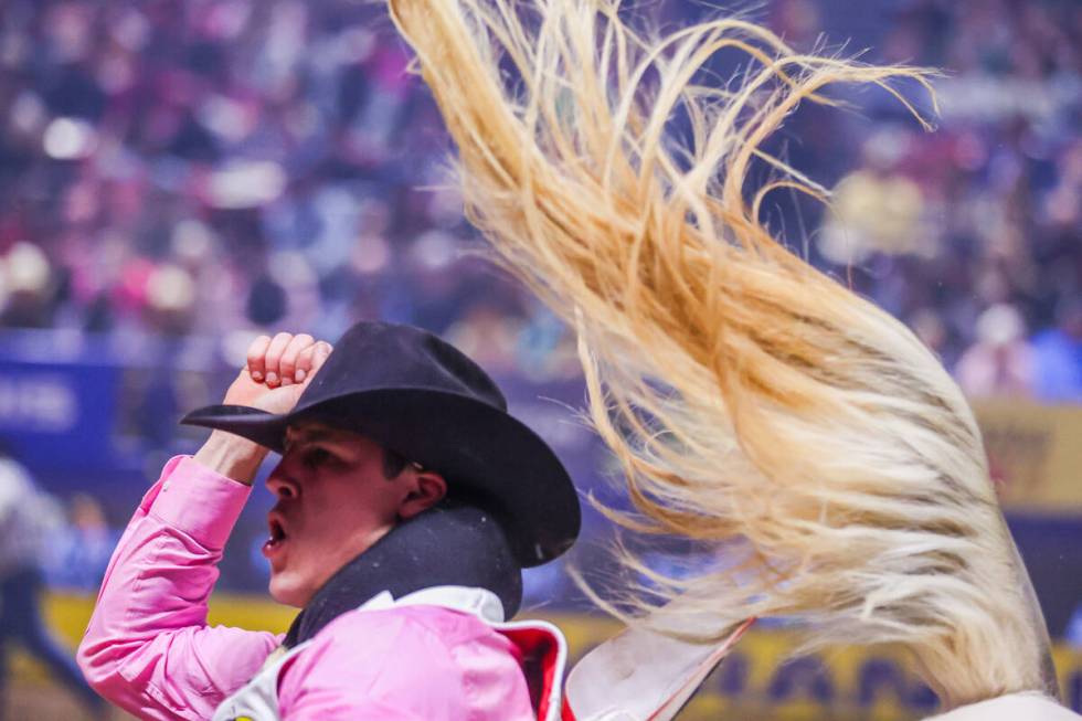 Jayco Roper celebrates his ride while competing in bareback riding on day four of the National ...