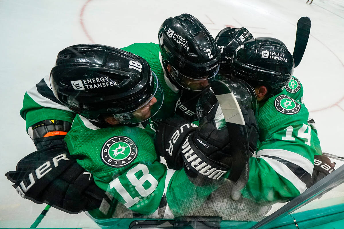 Dallas Stars center Sam Steel (18), defenseman Jani Hakanpaa (2), right wing Evgenii Dadonov (6 ...