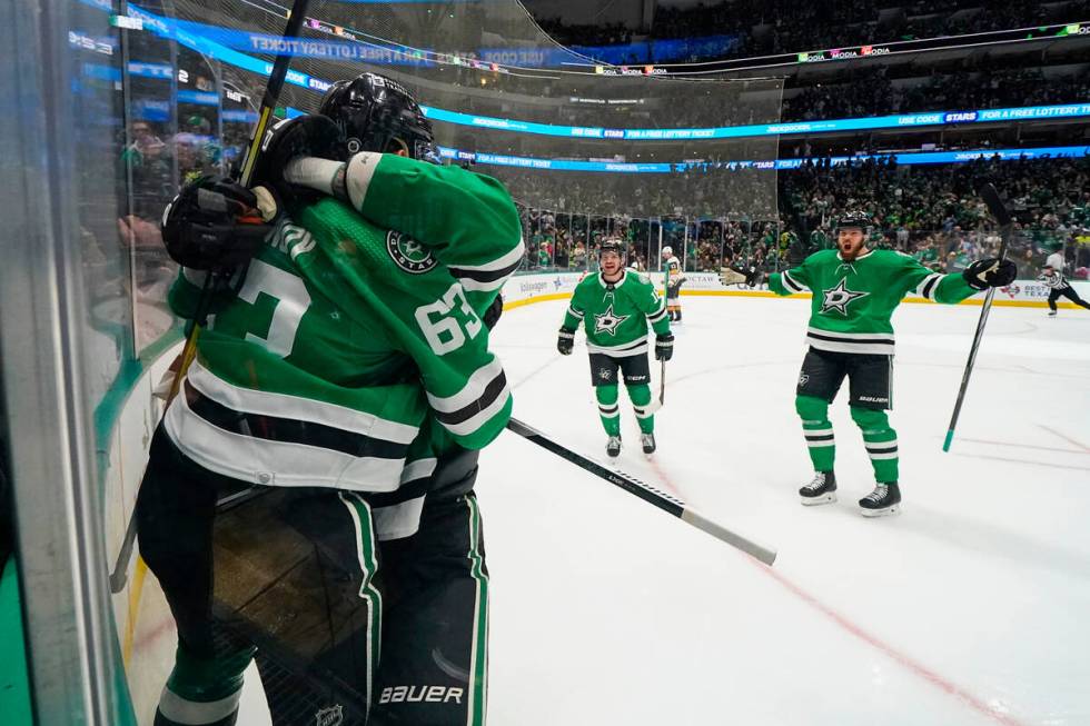 Dallas Stars right wing Evgenii Dadonov (63) celebrates his first period goal with teammates du ...