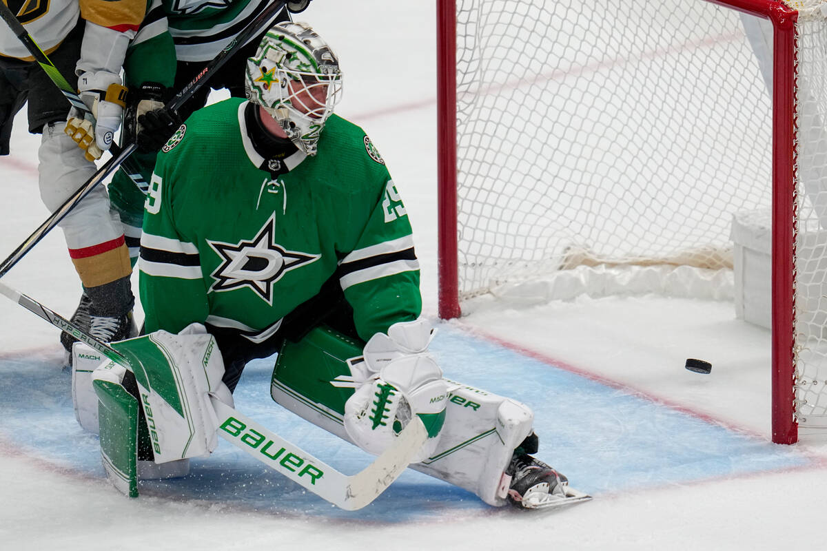 The puck is seen in the net of Dallas Stars goaltender Jake Oettinger on a goal by Vegas Golden ...