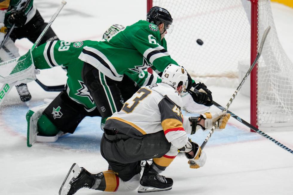 Vegas Golden Knights center Paul Cotter (43) scores a goal as Dallas Stars goaltender Jake Oett ...