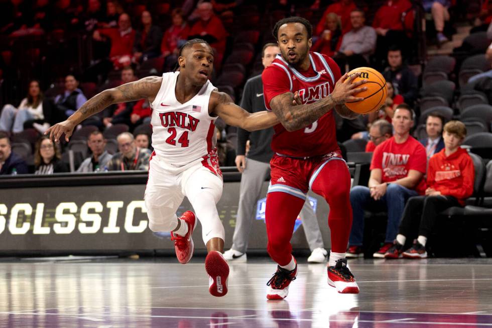 UNLV Rebels guard Jackie Johnson III (24) defends while Loyola Marymount Lions guard Justice Hi ...