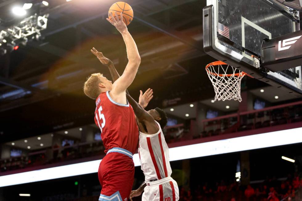 UNLV Rebels forward Kalib Boone (10) blocks a shot by Loyola Marymount Lions center Lars Thiema ...