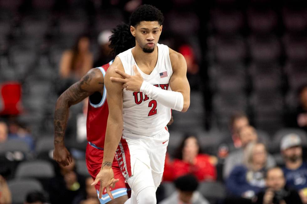 UNLV Rebels guard Justin Webster (2) celebrates after scoring a three-pointer during the first ...