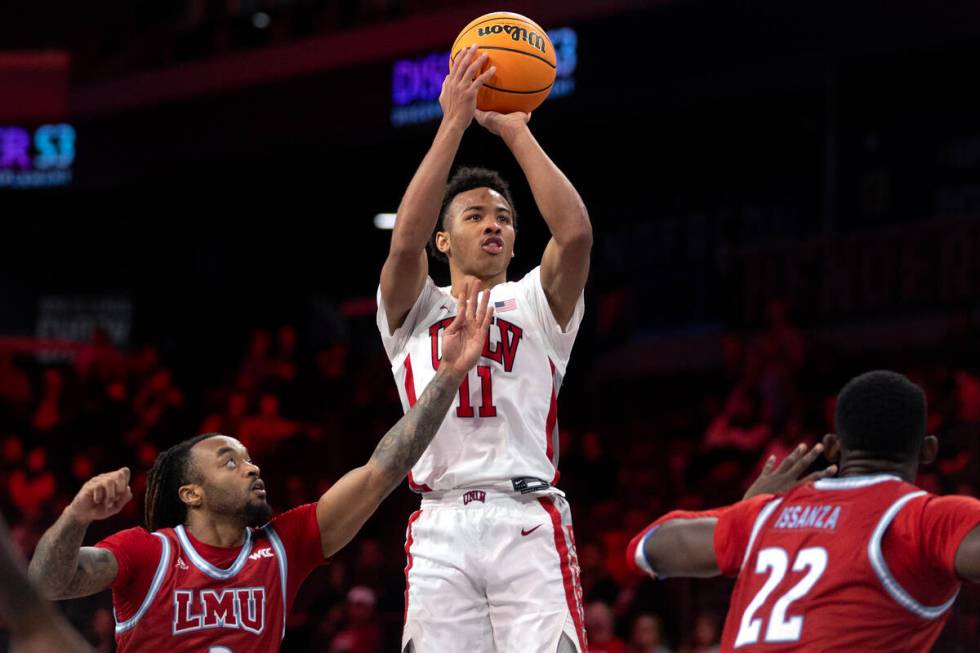 UNLV Rebels guard Dedan Thomas Jr. (11) shoots against Loyola Marymount Lions guard Justice Hil ...