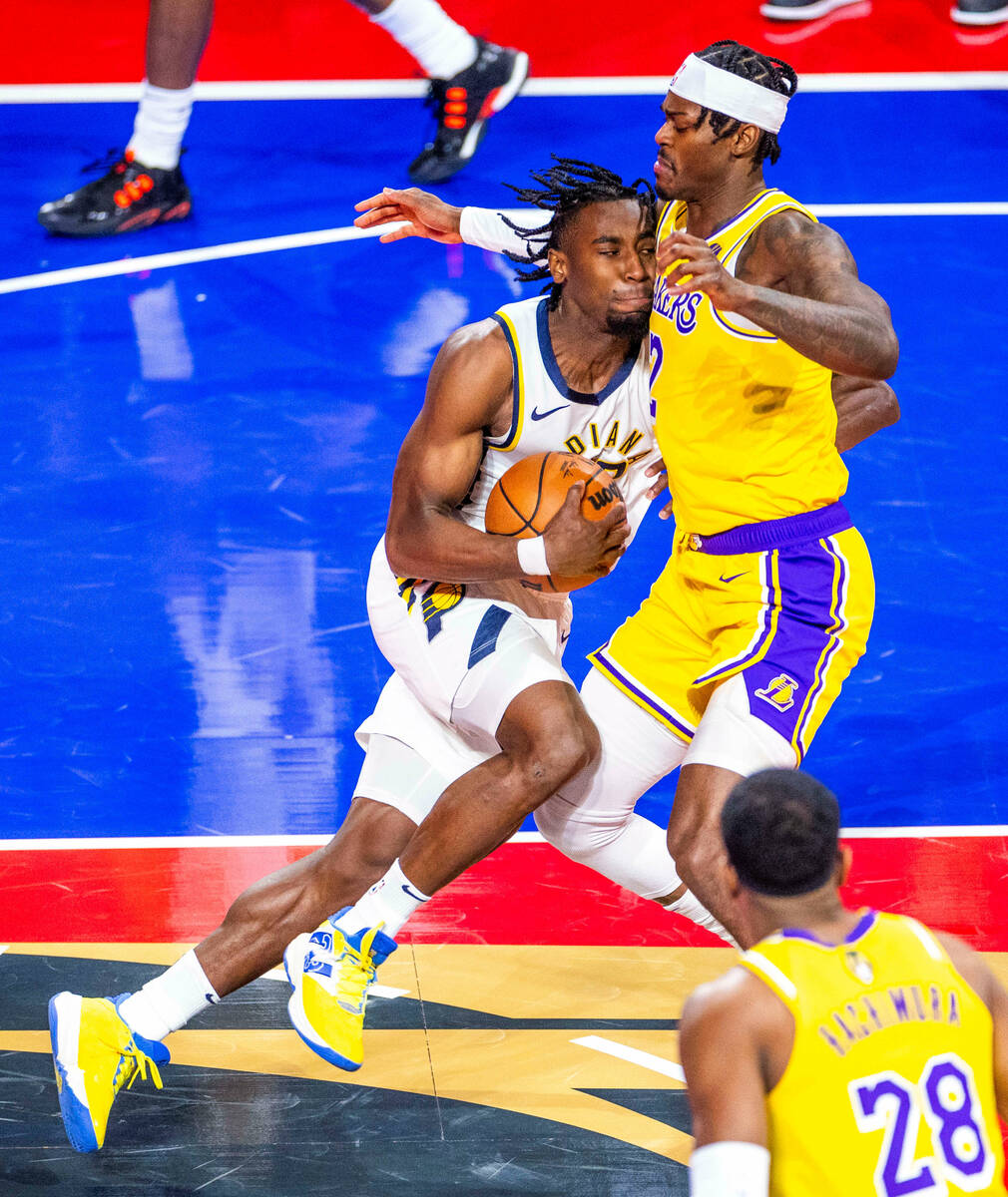 Indiana Pacers guard Bennedict Mathurin (00) runs into Los Angeles Lakers forward Jarred Vander ...