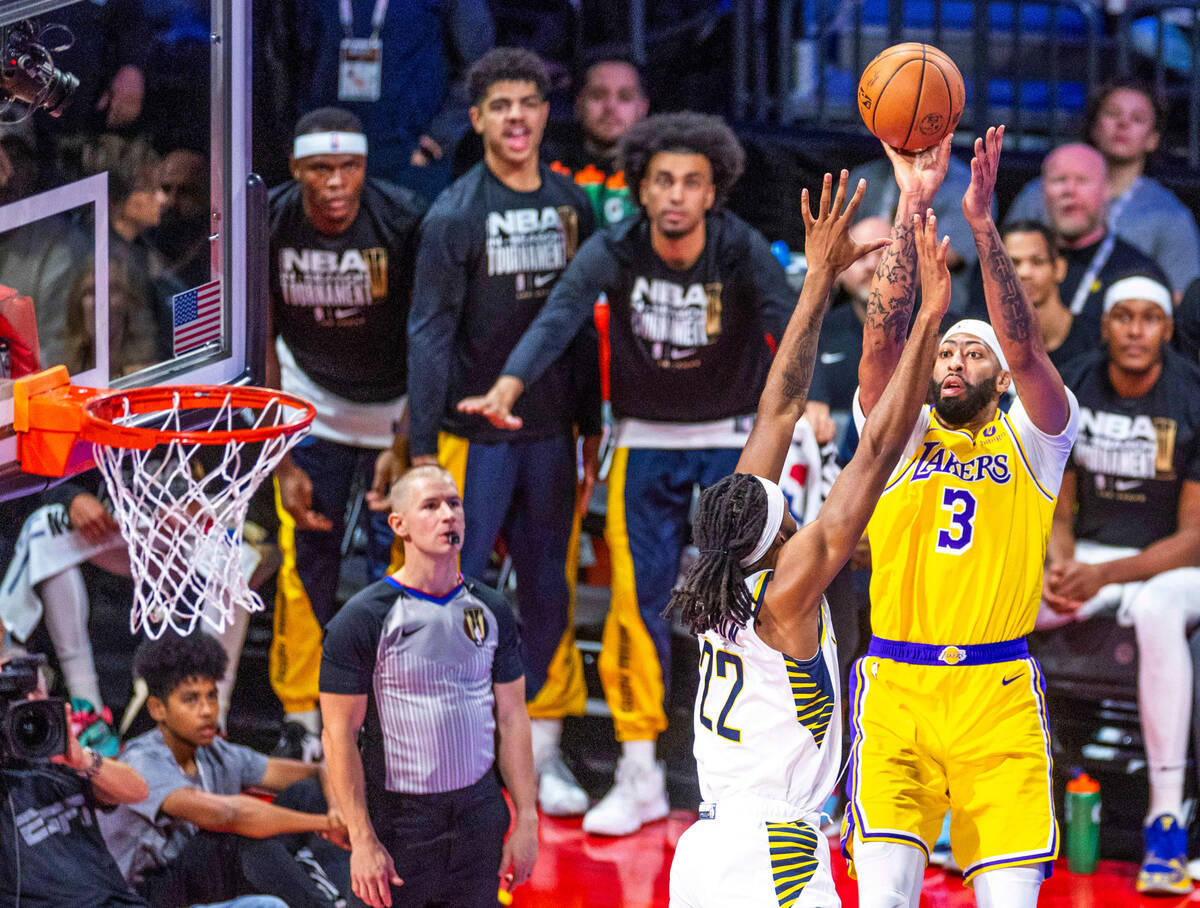 Los Angeles Lakers forward Anthony Davis (3) gets oo Ff a shot over Indiana Pacers forward Isa ...
