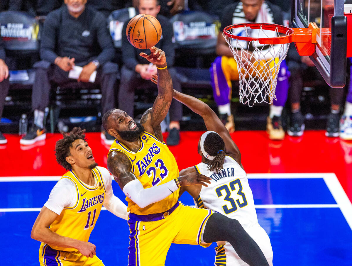 Los Angeles Lakers forward LeBron James (23) rejects a shot boy Indiana Pacers center Myles Tur ...