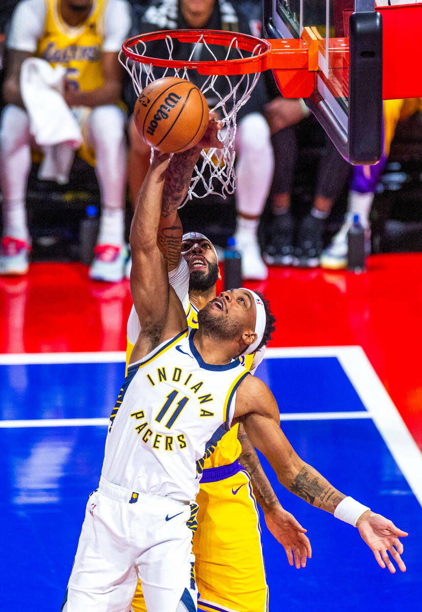 Indiana Pacers forward Bruce Brown (11) has a shot blocked by Los Angeles Lakers forward Anthon ...