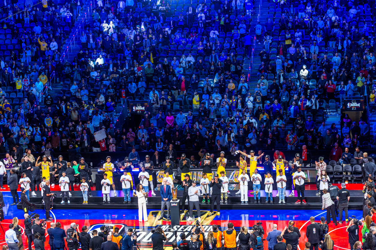 Los Angeles Lakers await their trophy after defeating the Indiana Pacers following the second h ...