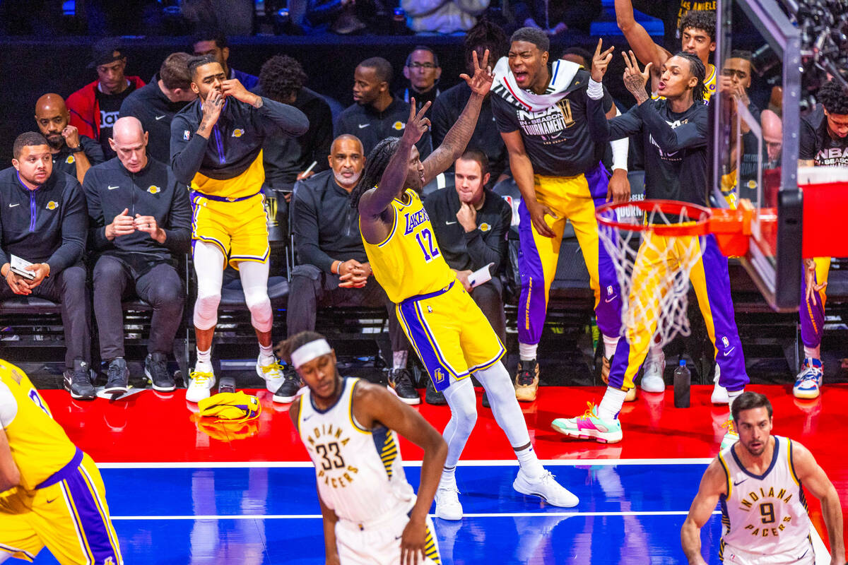 Los Angeles Lakers forward Taurean Prince (12) celebrates a 3-point basket Wirth teammates over ...