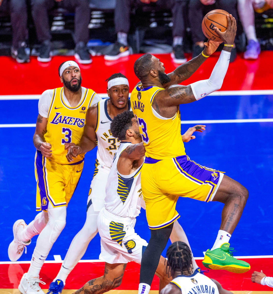 Los Angeles Lakers forward LeBron James (23) scores against the Indiana Pacers during the secon ...