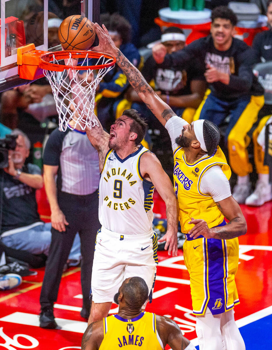 Indiana Pacers guard T.J. McConnell (9) has a shot blocked by Los Angeles Lakers forward Anthon ...