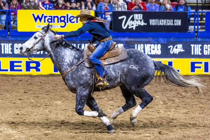 Lisa Lockhart of Oelrichs, SD., races home during Barrel Racing in the National Finals Rodeo Da ...