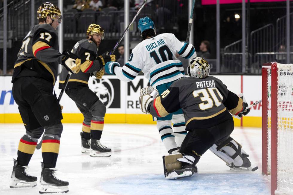 Vegas Golden Knights goaltender Jiri Patera (30) cannot save the puck while San Jose Sharks lef ...