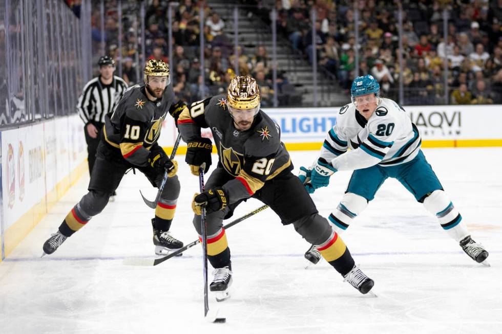 Vegas Golden Knights center Chandler Stephenson (20) takes the puck upice followed by Knights c ...