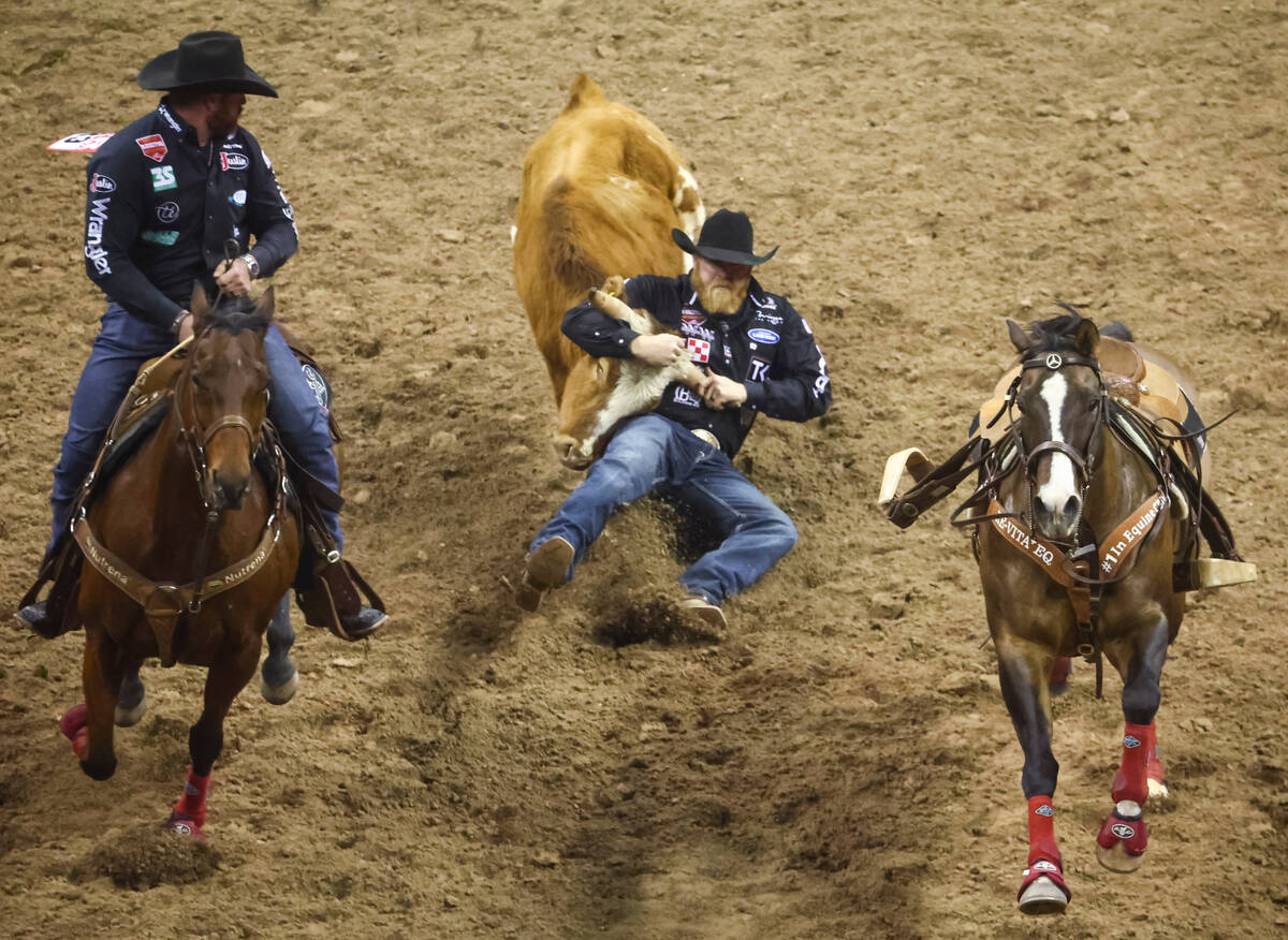 Will Lummus, of Byhalia, Miss., competes in steer wrestling during the first night of the Nati ...