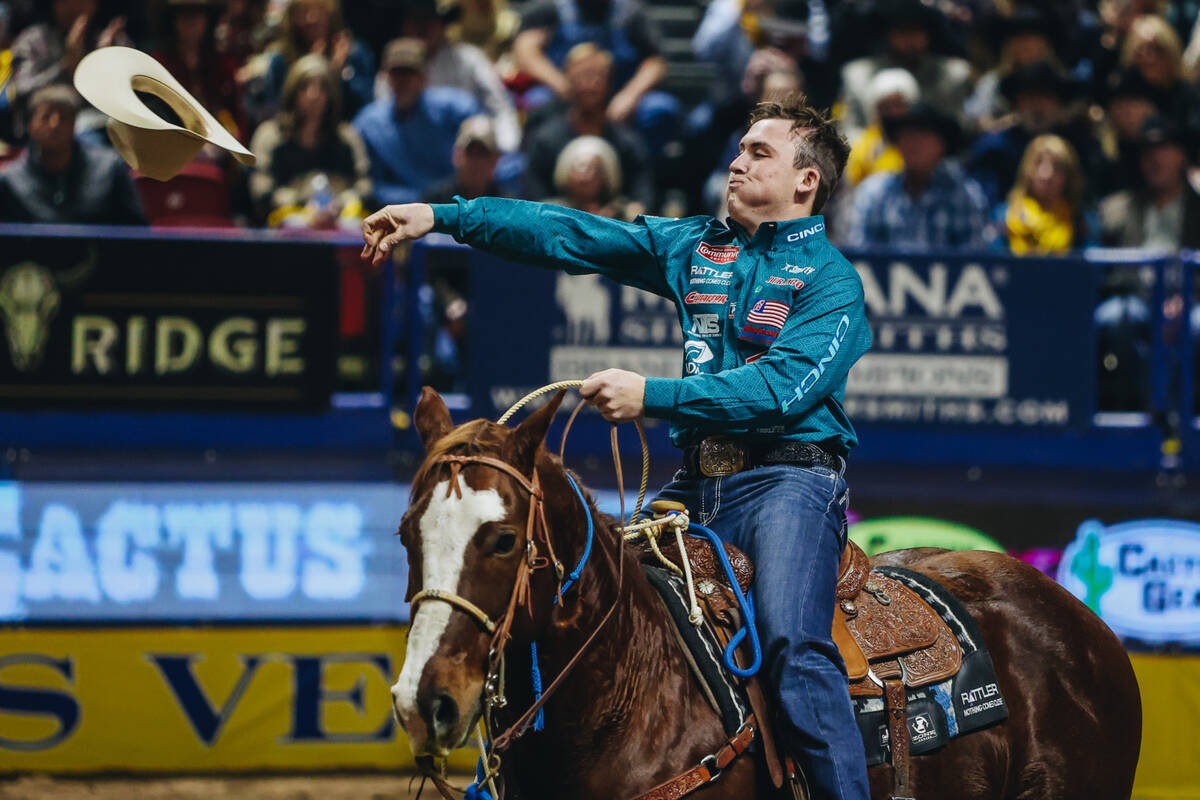 Riley Webb celebrates his time during the tie down roping portion of day three of the National ...