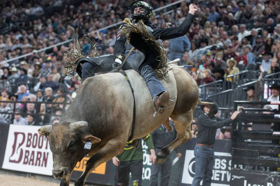 Cody Teel rides SweetPro's Bruiser during day two of the PBR World Finals on Thursday, Nov. 7, ...