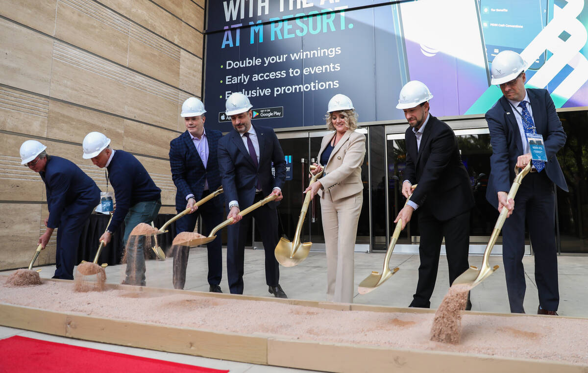 Henderson Mayor Michelle Romero, center, along with General Manager of M Resort Hussain Mahrous ...