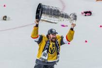 Golden Knights right wing Mark Stone (61) hoists the Stanley Cup after their 9-3 win over the F ...