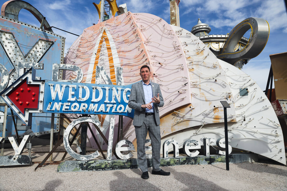 Aaron Berger, executive director of the Neon Museum, addresses donors and media in front of one ...