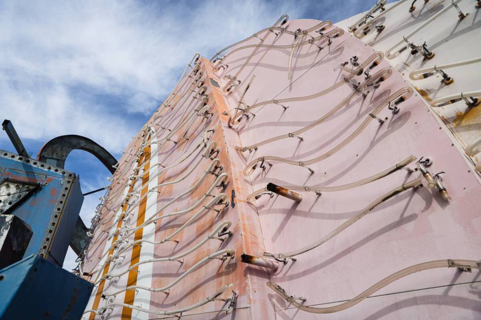 The 1967 pylon Flamingo sign that will be restored and relit, along with two 1976 feather plume ...